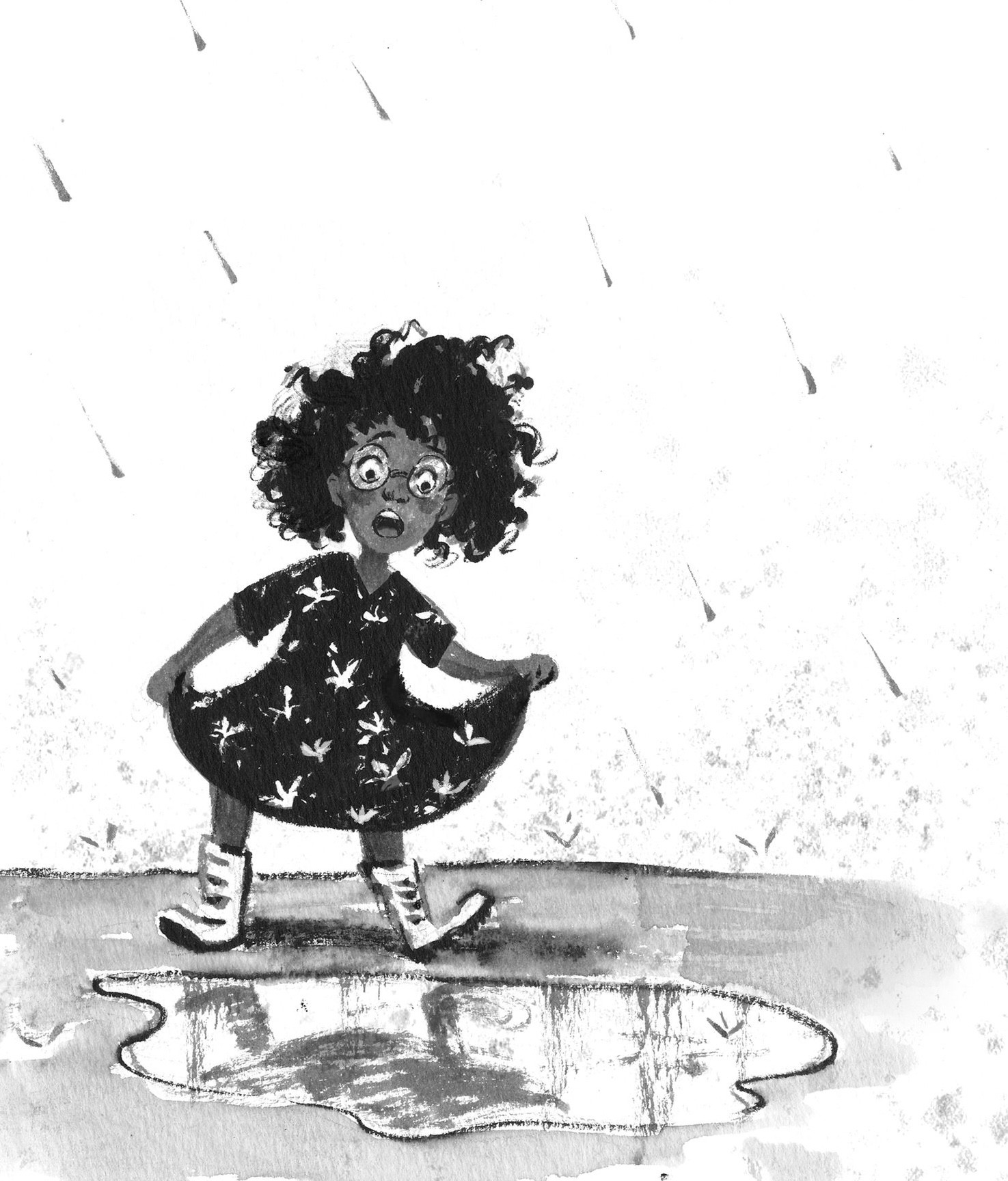 Child dancing in the rain over a puddle
