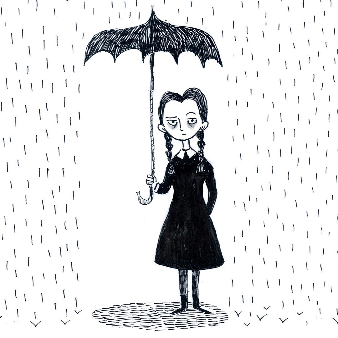 Girl in black holding an umbrella in the rain